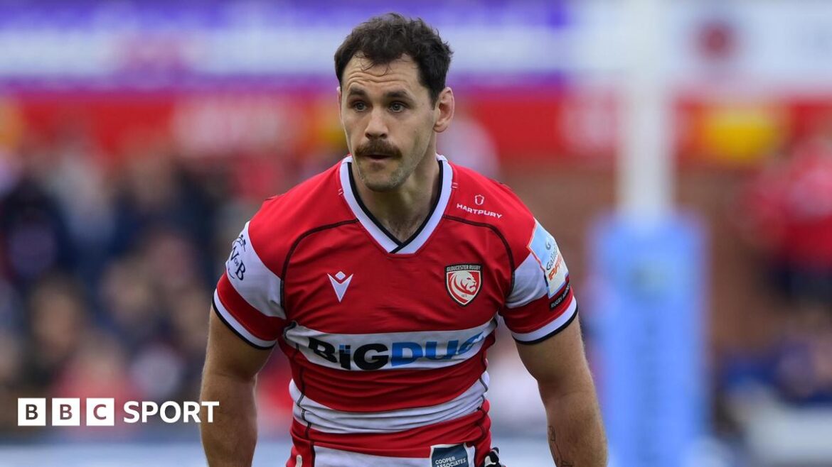 Tomos Williams standing on the pitch during a match for Gloucester