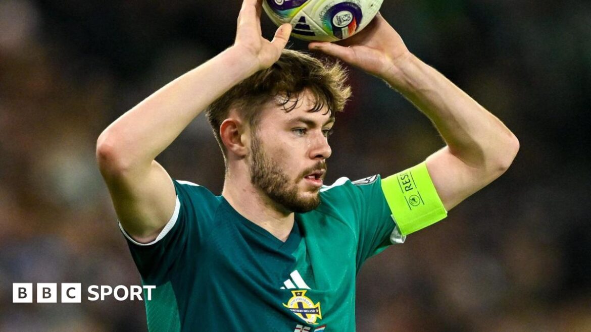 Conor Bradley takes a throw in
