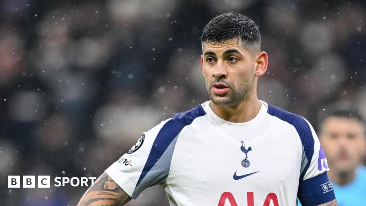 Cristian Romero playing for Tottenham, wearing a captain's armband