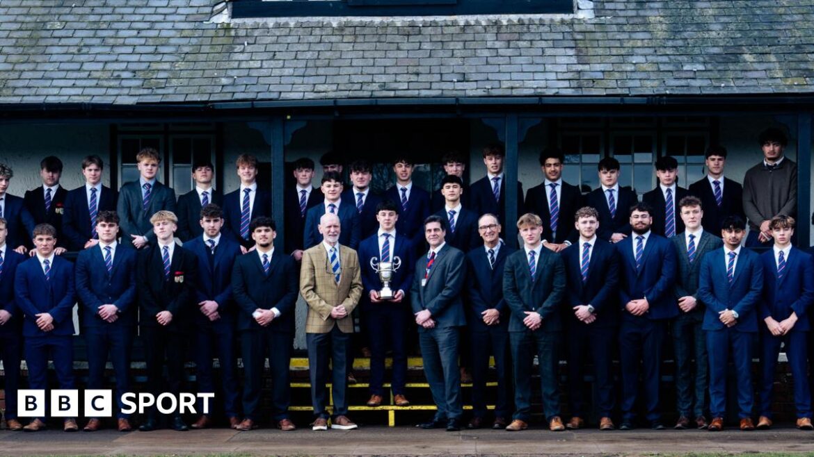 Students and coaches from Northampton School for Boys have their picture taken with the Daily Mail Trophy
