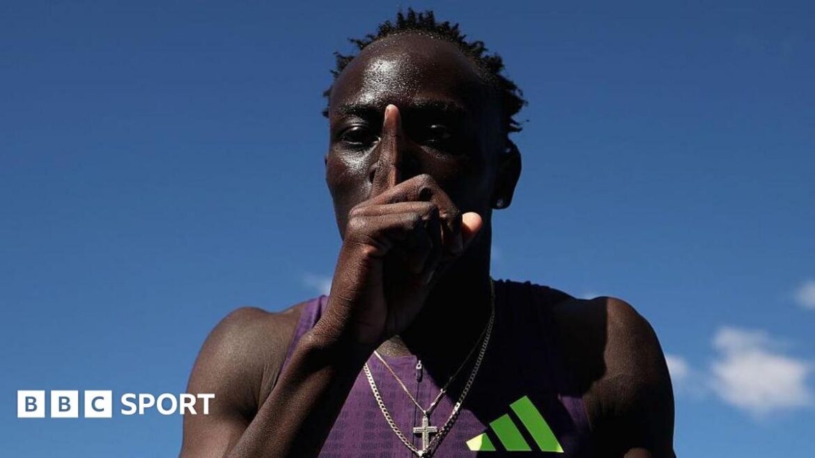 Australian sprinter Gout Gout puts his finger to his lips and makes a '1' sign after his win