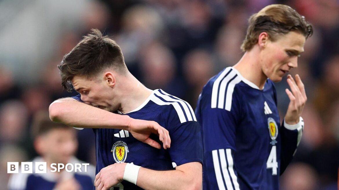 Scotland's Kieran Tierney and Scott McTominay look dejected