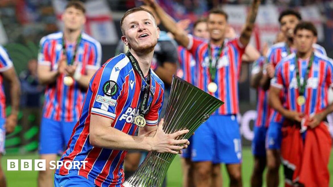 Adam Wharton celebrates with Conference League trophy
