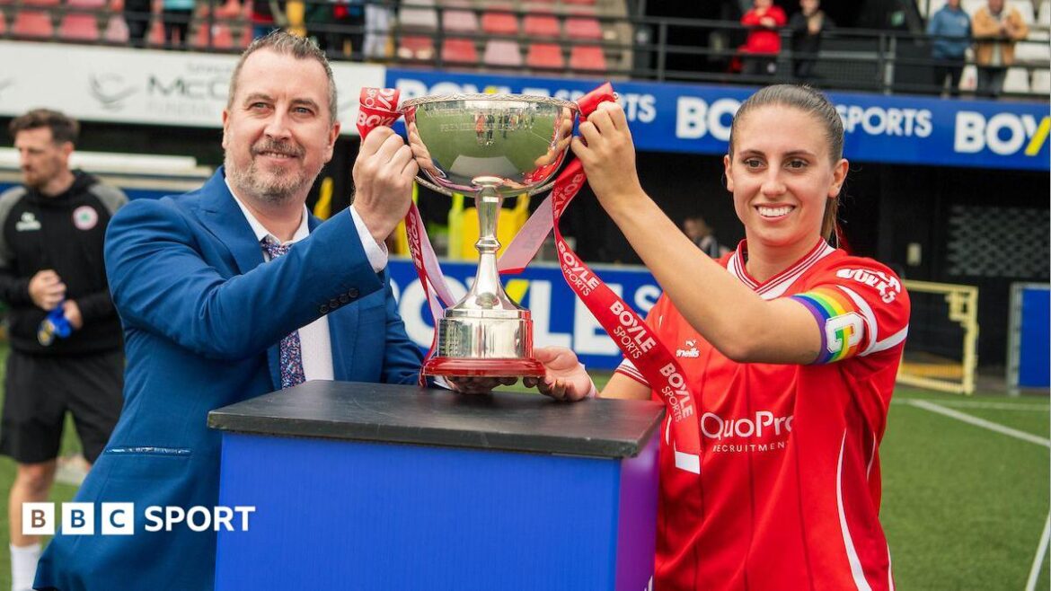 Kelsie Burrows with League Cup trophy