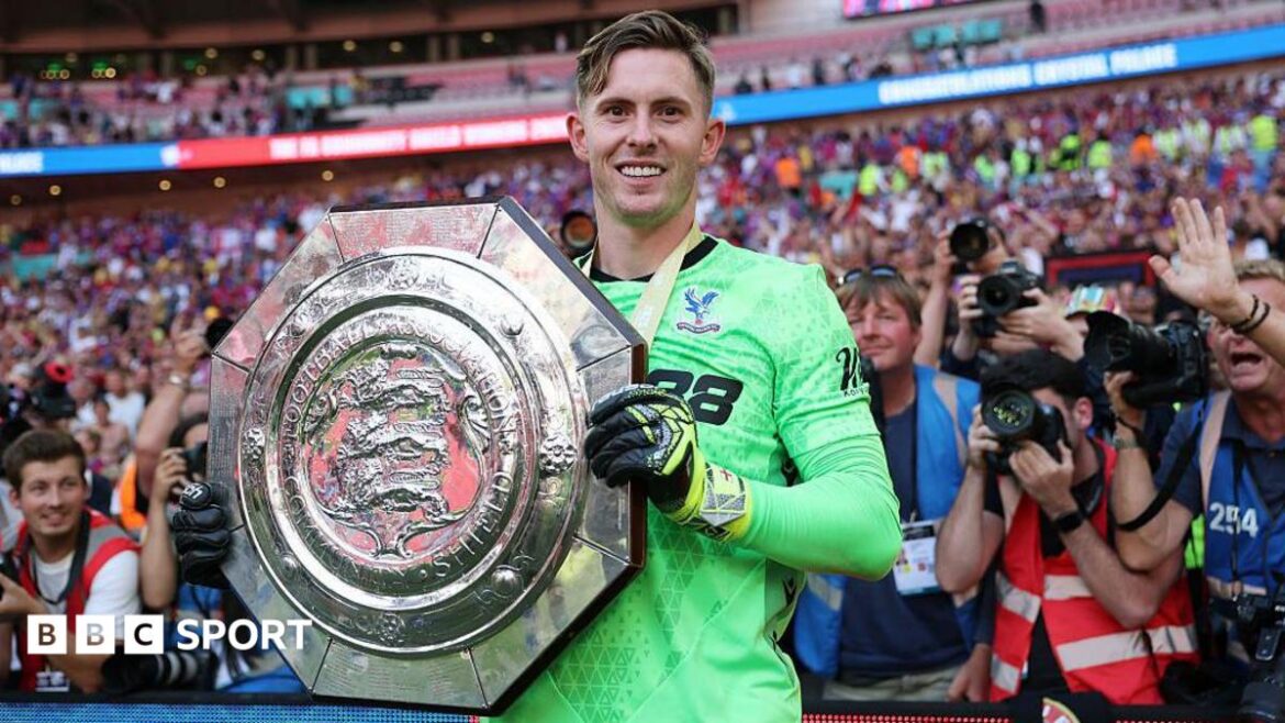 Crystal Palace keeper Dean Henderson holds up the Community Shield after his side's penalty shootout win over Liverpool