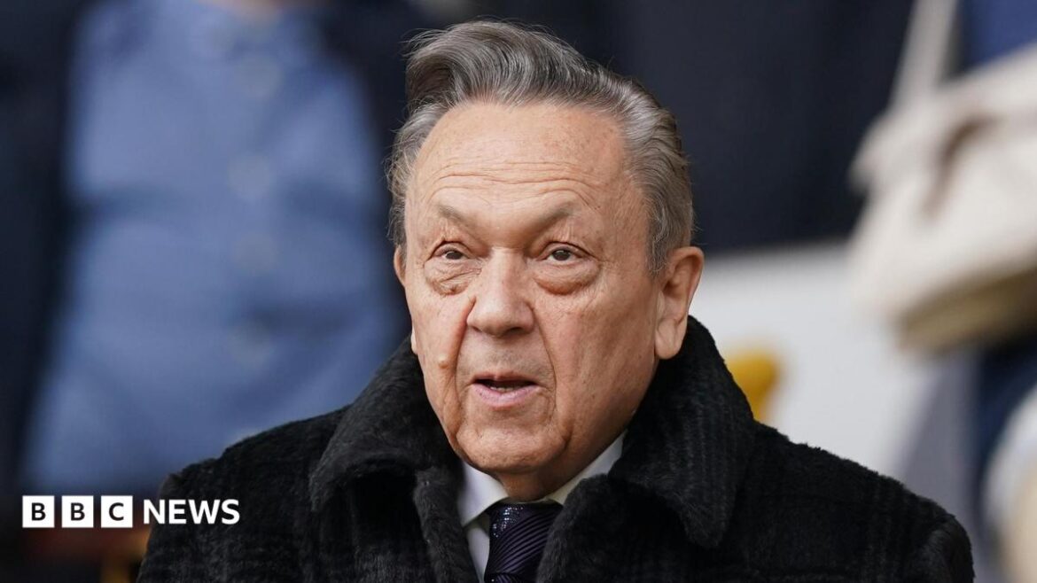 David Sullivan, wearing a dark coat and tie, shown down to his shoulders.