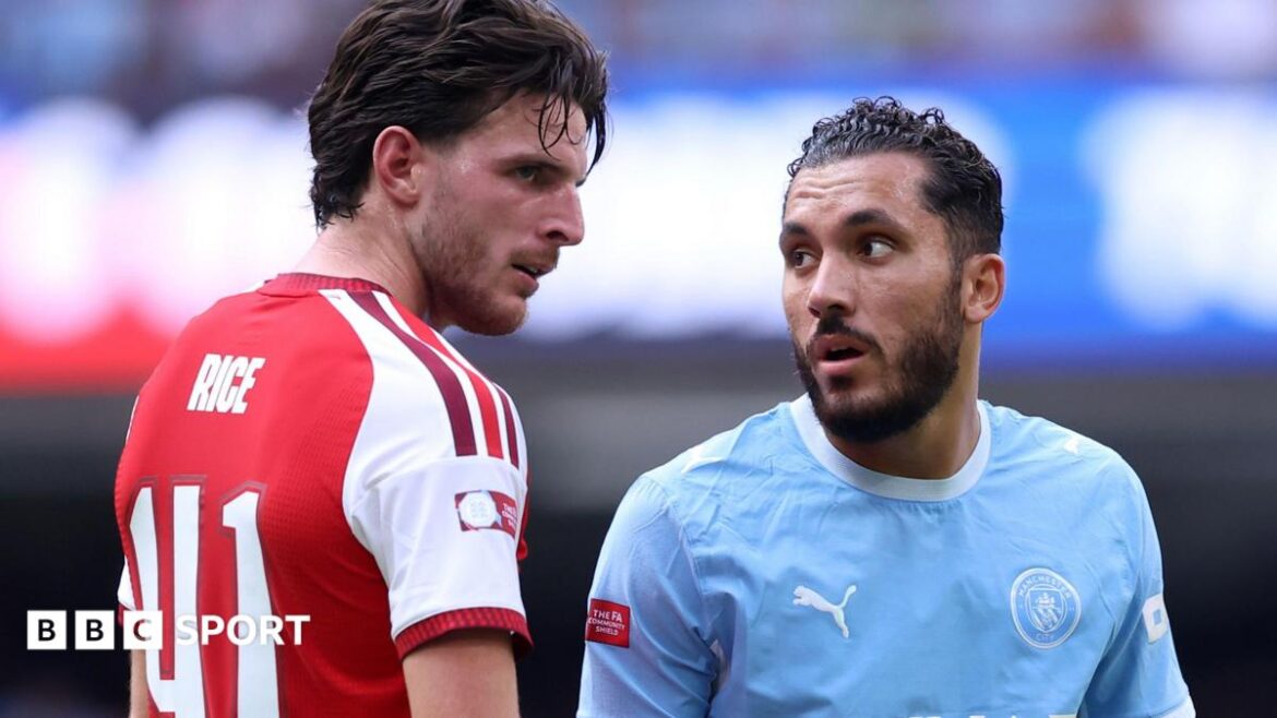 Rayan Cherki looks at Declan Rice during the Community Shield